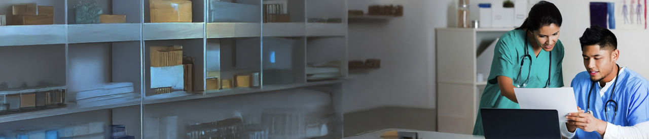 healthcare providers looking at laptop in office