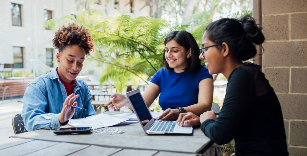 College students chat with laptops