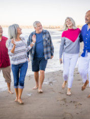 Older couples walking on the beach