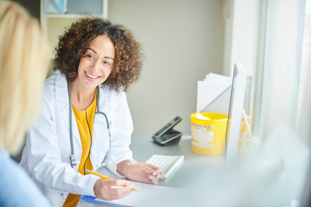 happy female doctor with her patient