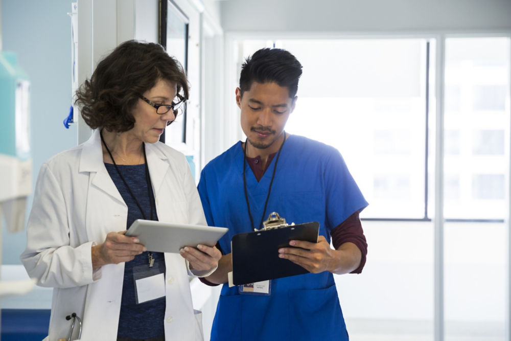 Doctor and nurse conferring 