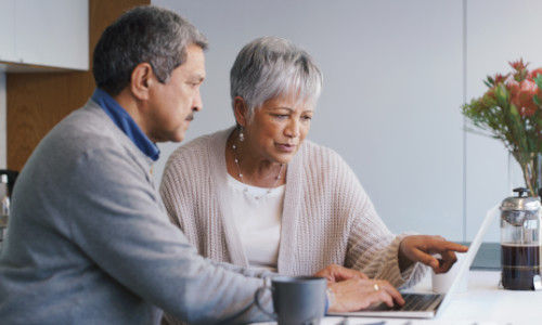 Connecticare Medicare members reviewing their member ID card on laptop