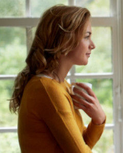 Woman with a mental health condition looking out of a window