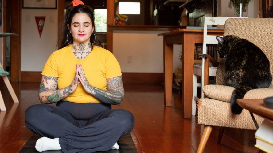 young-woman-meditating-on-floor