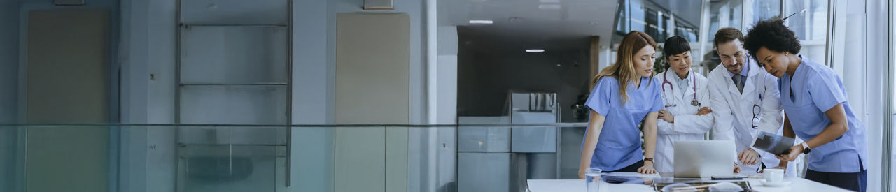 group of providers in health care around computer