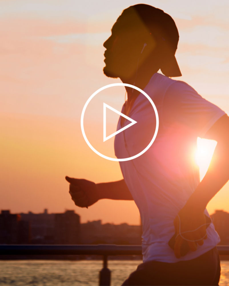 adult man exercising at sundown