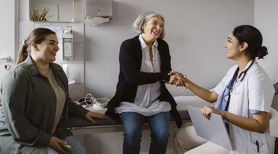 patient with caregiver at doctor's office