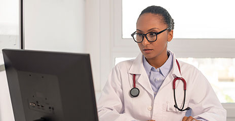 doctor working at computer in the office