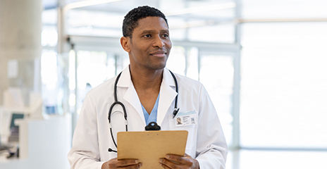  doctor working at the hospital and holding a clipboard 