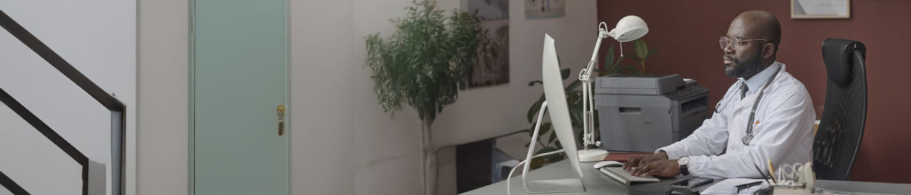 healthcare provider looking at computer in office