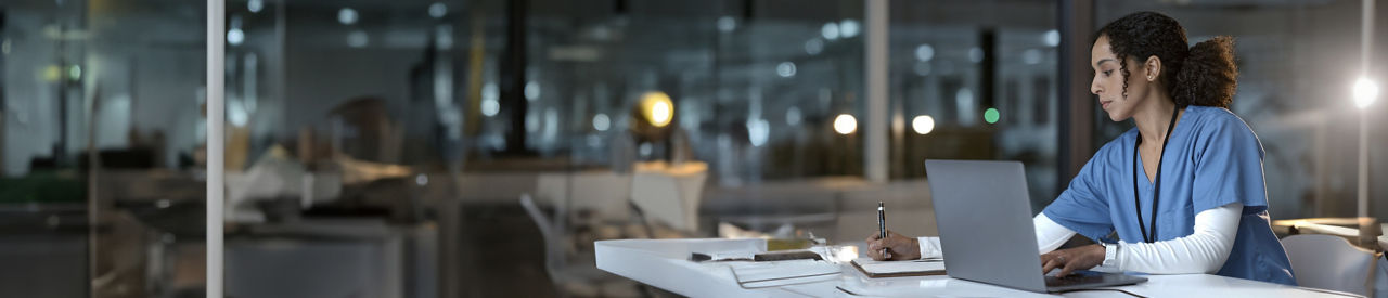 healthcare provider looking at computer in office