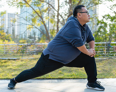 man stretching outside