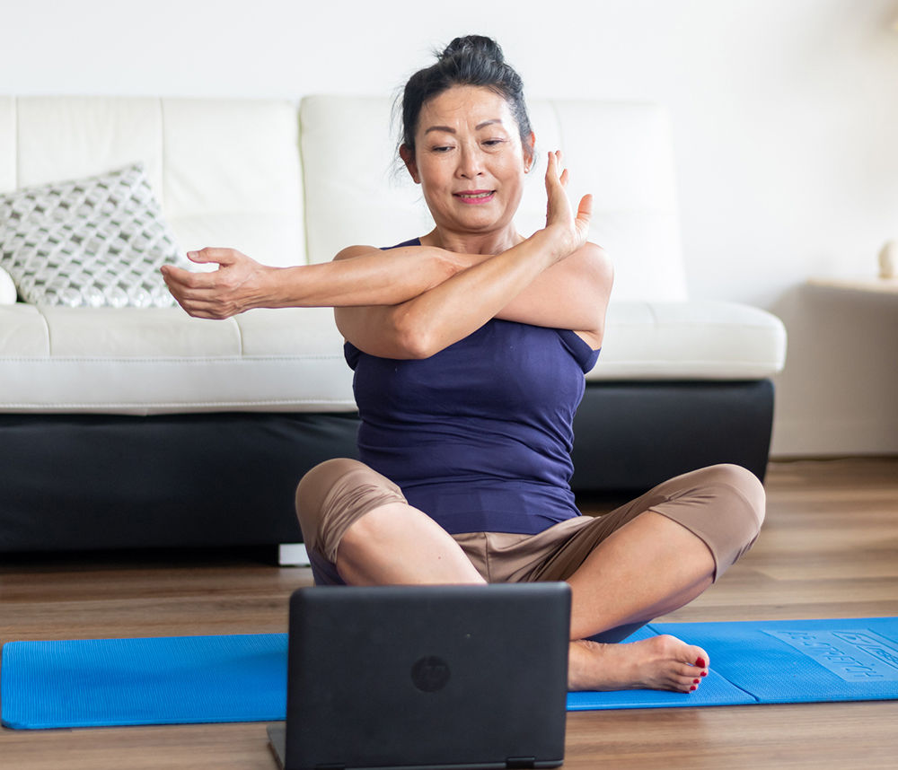 Woman stretching at home