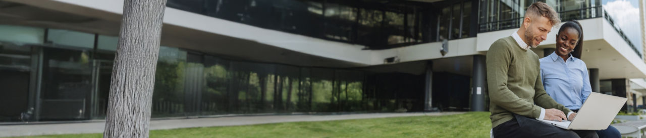 colleagues talking and sitting outside of the office