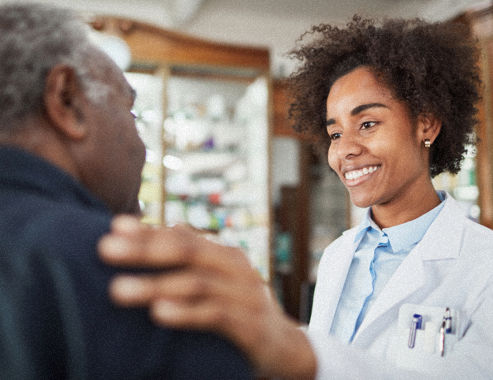 Young female doctor with older patient