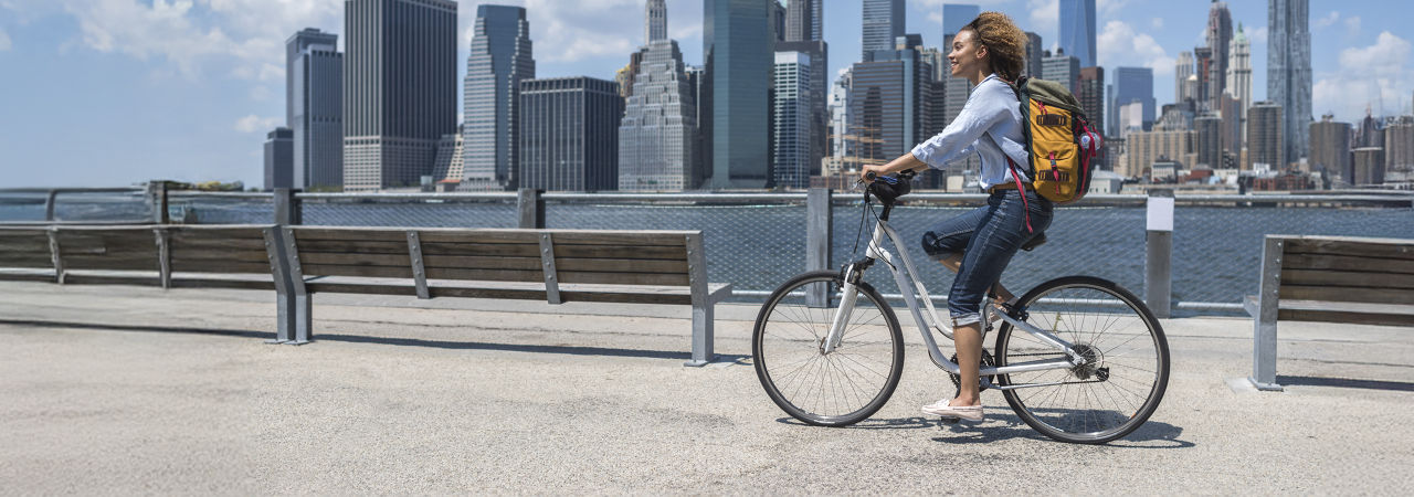 woman bike riding in city