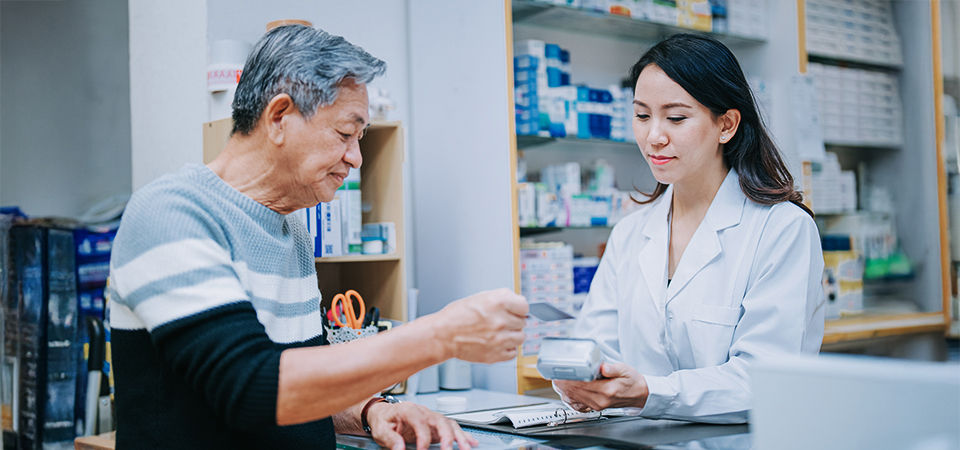 pharmacist talking to customer