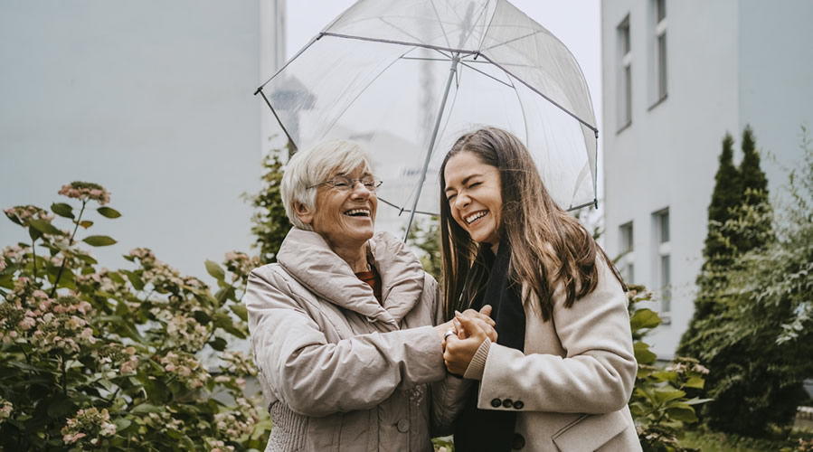 senior woman talking with female healthcare