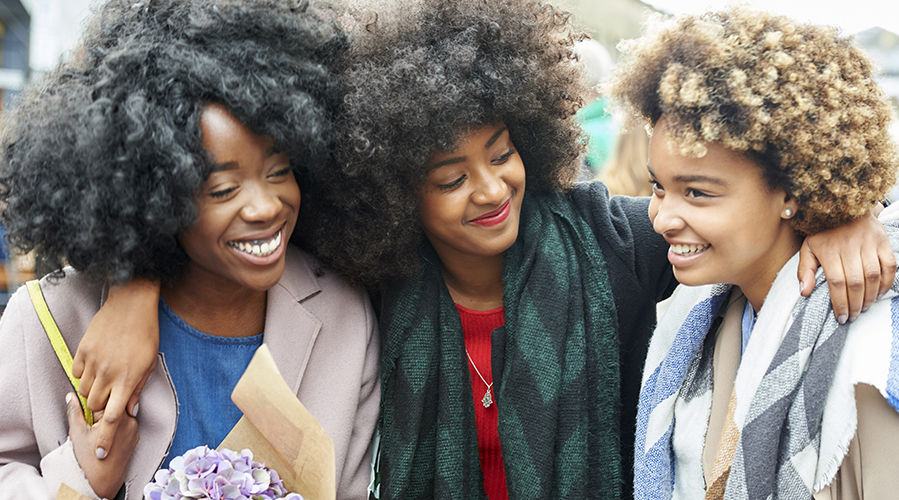 group of three female happy friends 