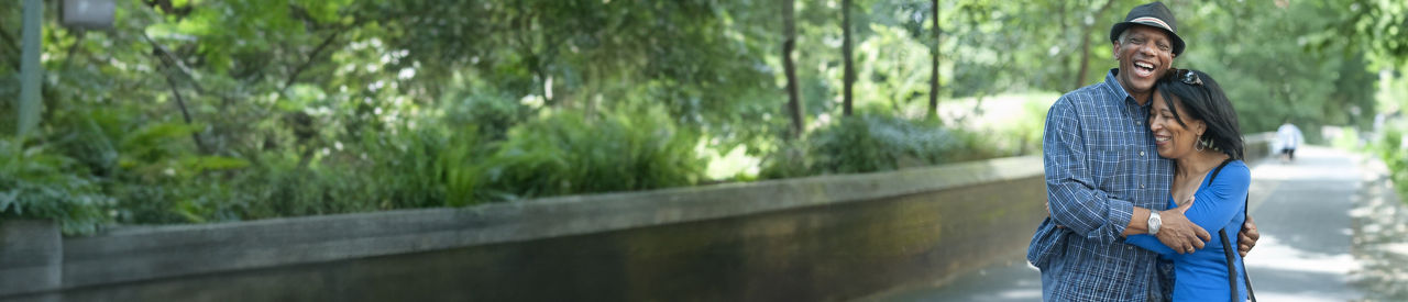 two people in park hugging