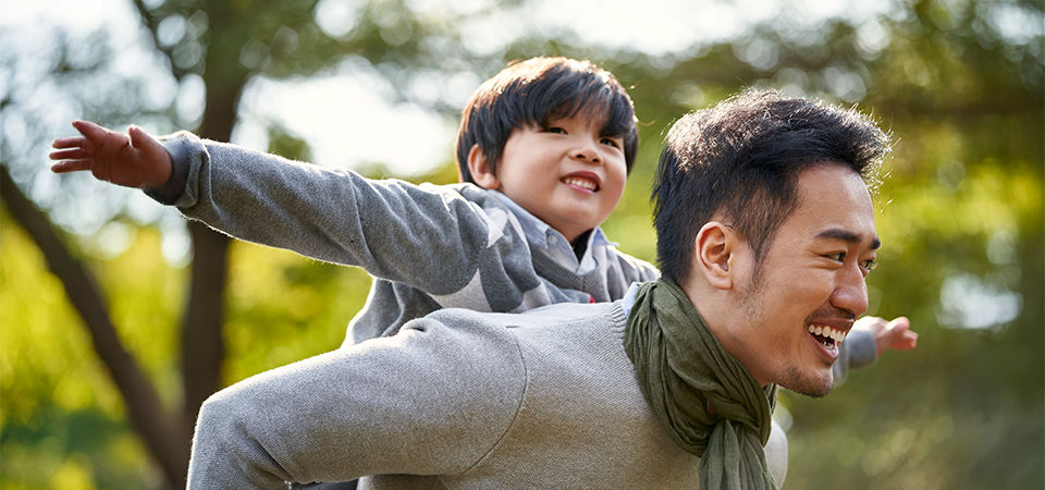 asian father and son outside