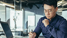 man at computer in office 