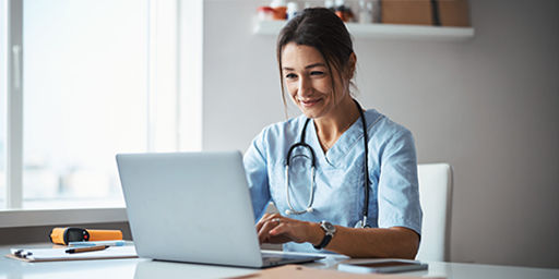 doctor looking at laptop