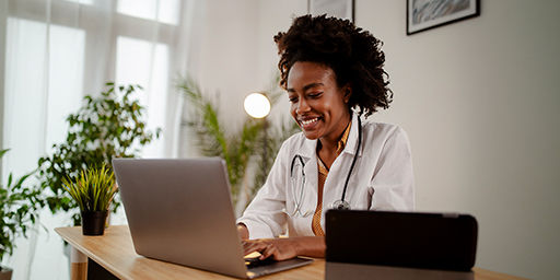doctor looking at laptop