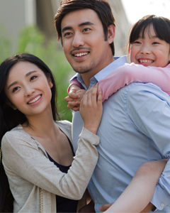 Chinese family smiling for a picture
