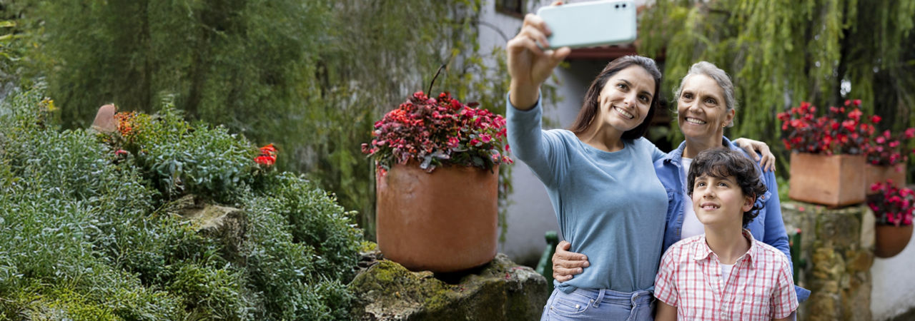 multigenerational family in garden taking a selfie