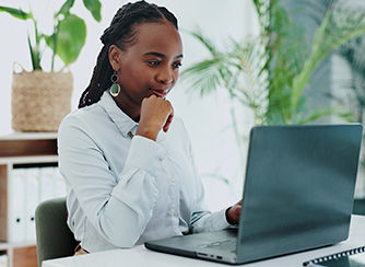 person on computer at home