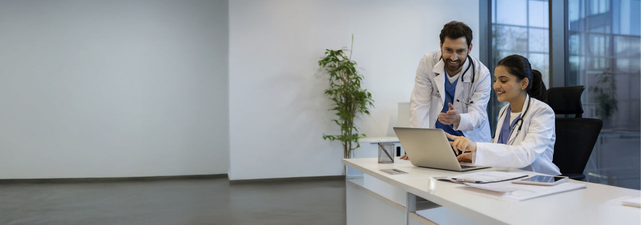 health care providers lookung at phone outside
