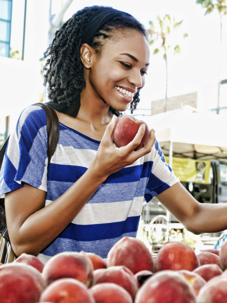 girl holding apple