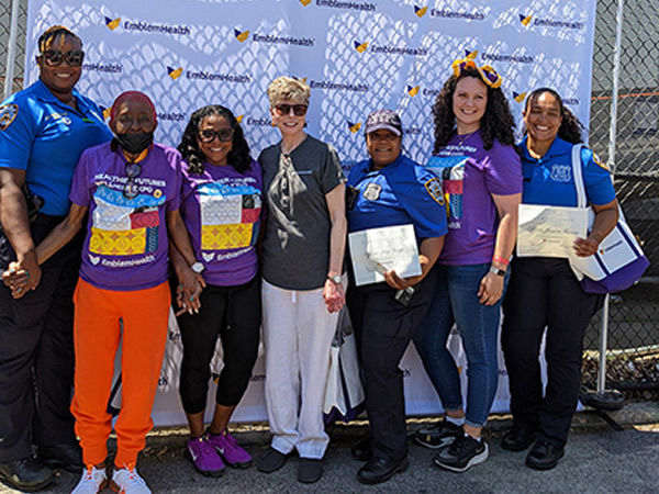 EmblemHealth team posing with NYPD members