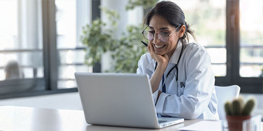 health care providers lookung at a computer in office