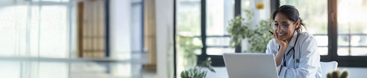 health care providers lookung at a computer in office