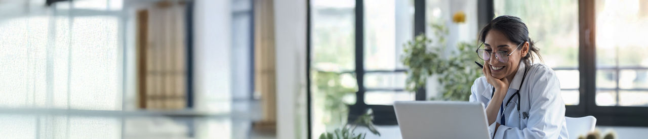 health care providers lookung at a computer in office