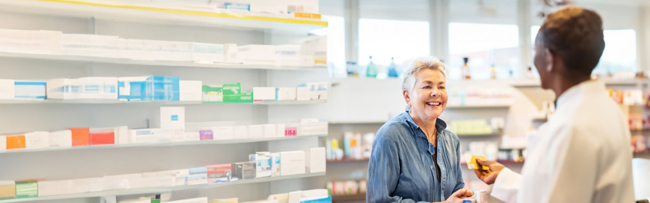 Senior woman talking with her pharmacist. 