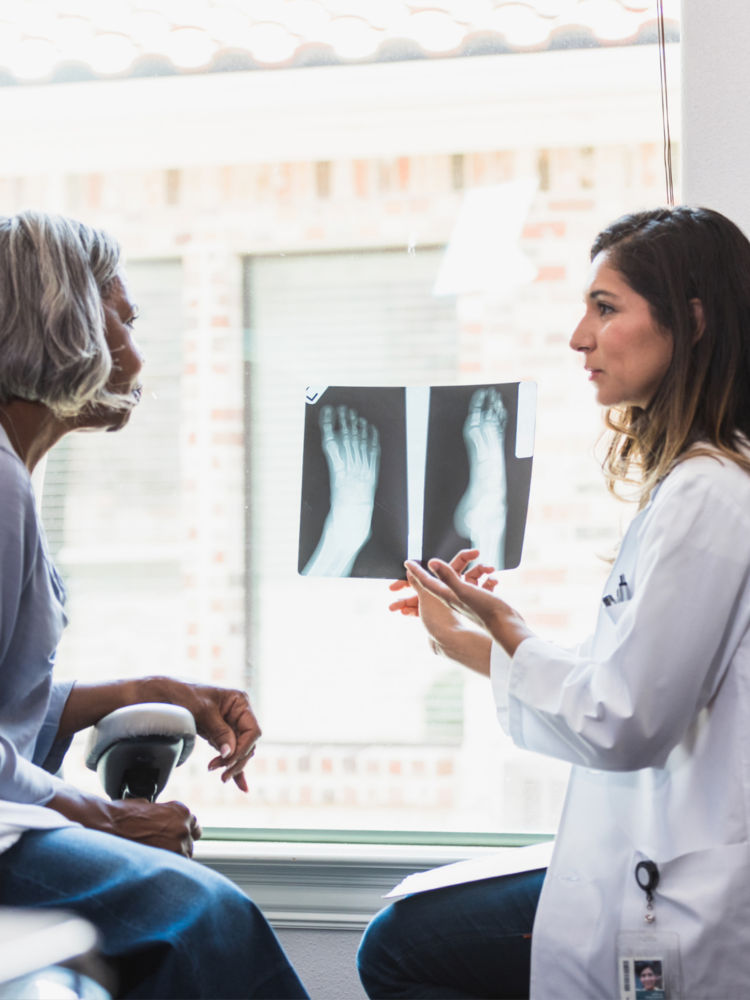 Two women looking at x-rays