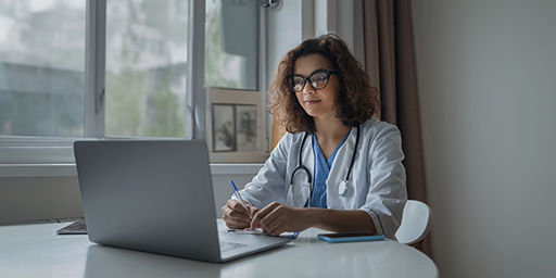 health care provider at computer 