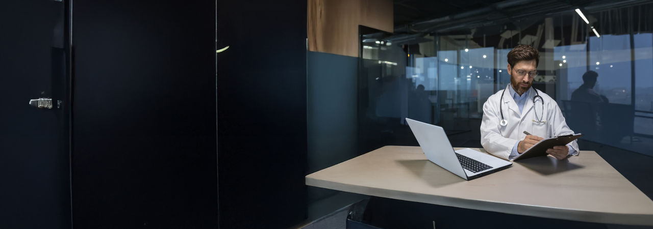 health care providers lookung at a tablet in office