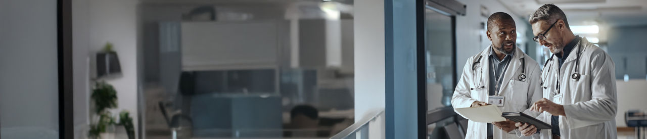 health care providers lookung at a tablet in office