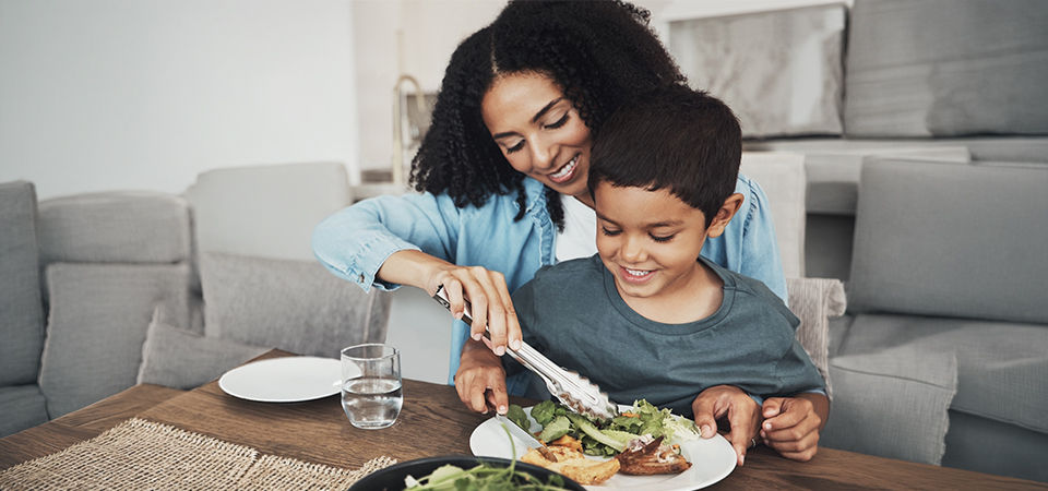 child and mother eating