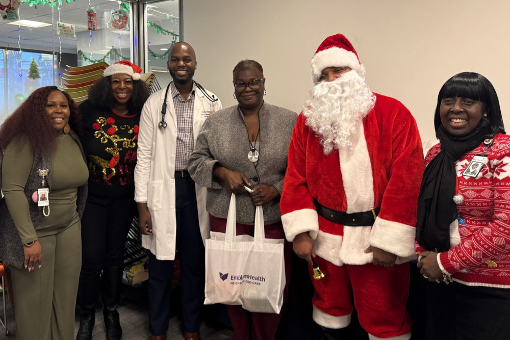 New York State Senator Roxanne Persaud at a toy giveaway event with staff from EmblemHealth Neighborhood Care East New York, providers from AdvantageCare Physicians East New York Medical Office, and community members. 