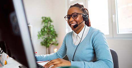 Customer support specialist working on computer