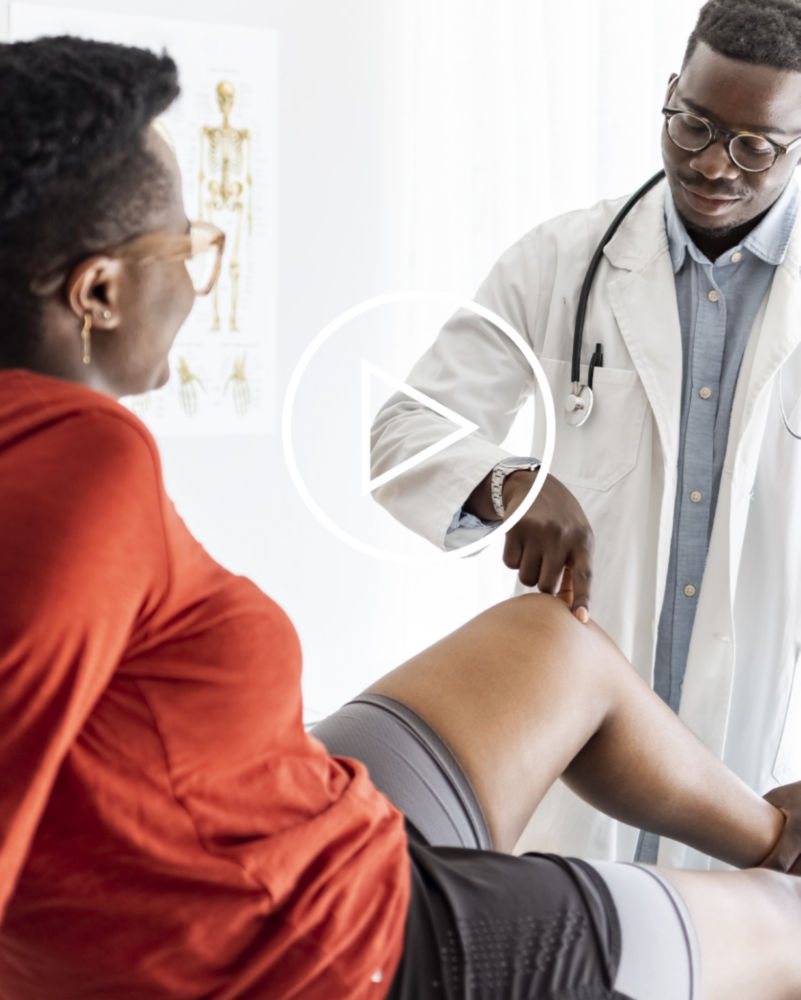 Doctor testing patients knee