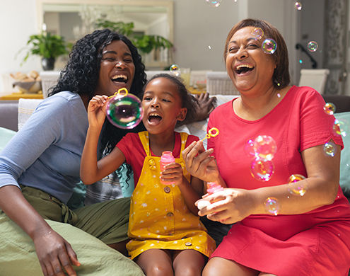 multigenerational females blowing bubbles